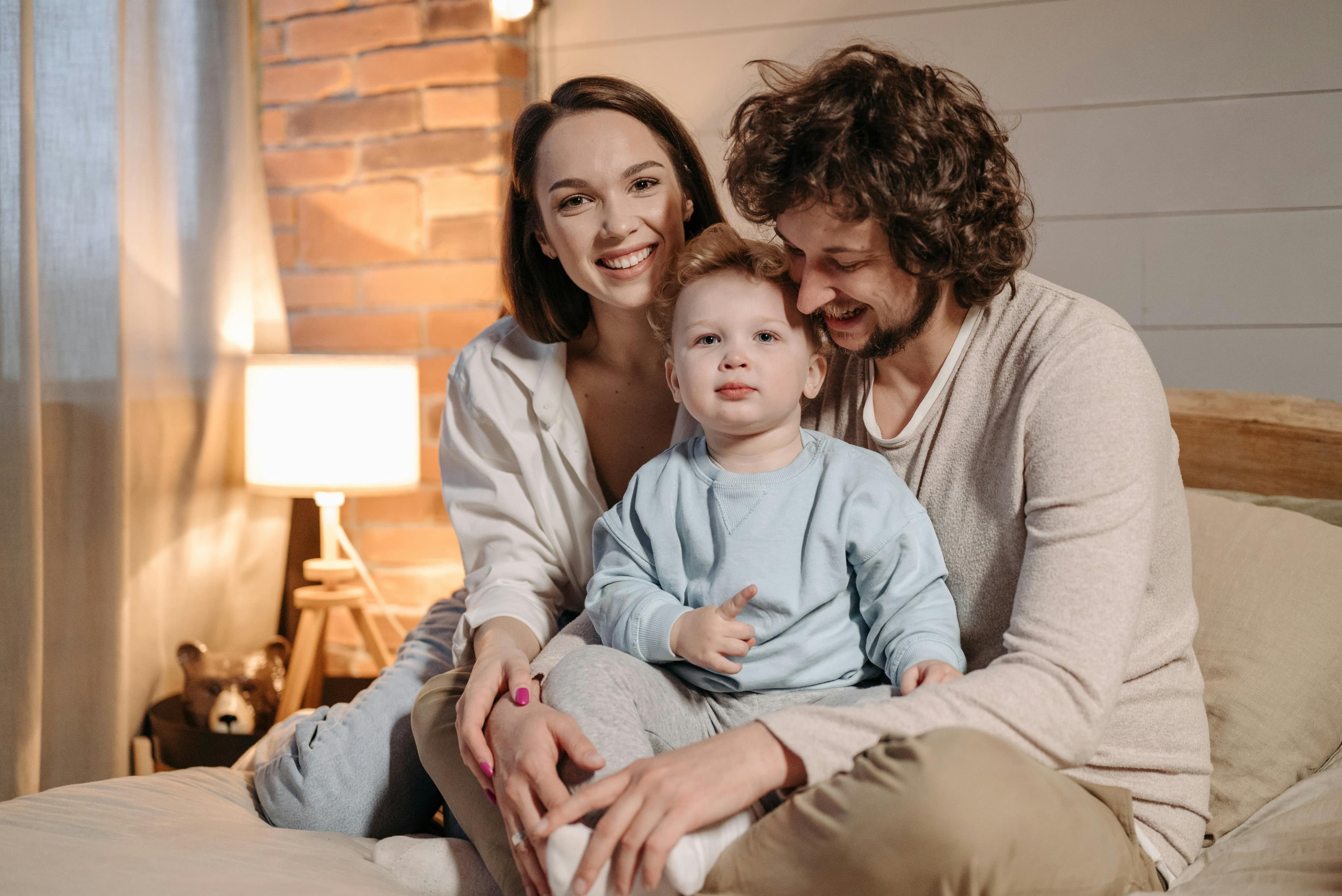 Parent reviewing a hospital bill at home while sitting with their child